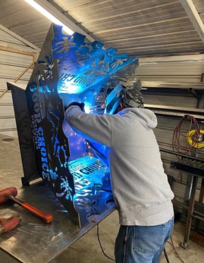 CNC Plasma Cuts - Wrought iron gate with an arched top and decorative details, creating a welcoming and inviting entrance