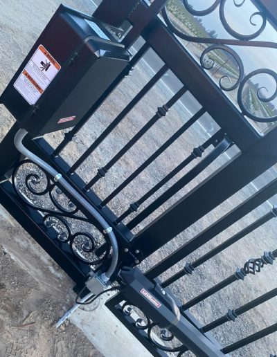 Double driveway gate with an automatic opener, providing convenient and secure access to the property