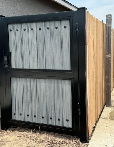 High-quality metal gate with a wood-grain finish, enhancing the aesthetic appeal of the home