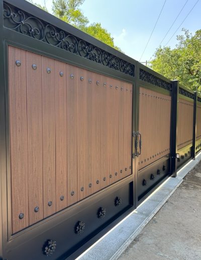 Metal gate with a decorative design, creating a welcoming and inviting entrance