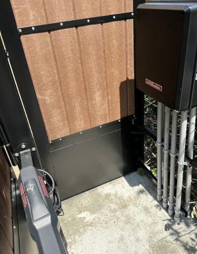 Durable black metal double gate with decorative accents, offering both style and protection