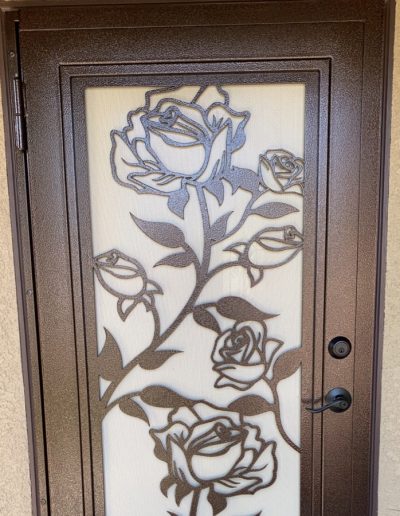 Ornate black metal gate with detailed craftsmanship and decorative flourishes