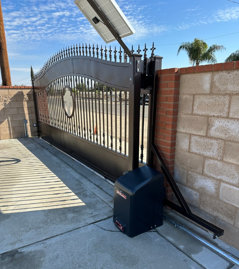 Best Iron Gates Contractor - Decorative black metal double gate, enhancing the privacy and security of the property