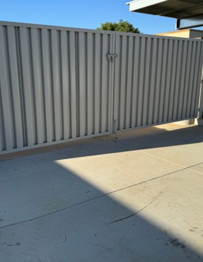 Metal fence and gate installation, showcasing professional craftsmanship and attention to detail