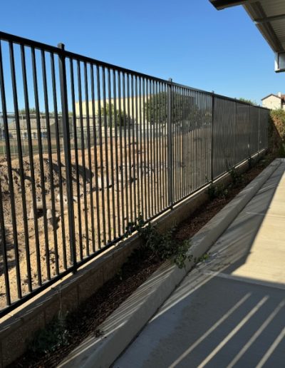 High-quality metal gate with a decorative finish, adding value and curb appeal to the property