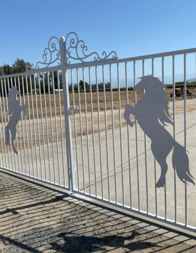 Ornate Victorian-style gate with elaborate scrollwork and floral motifs